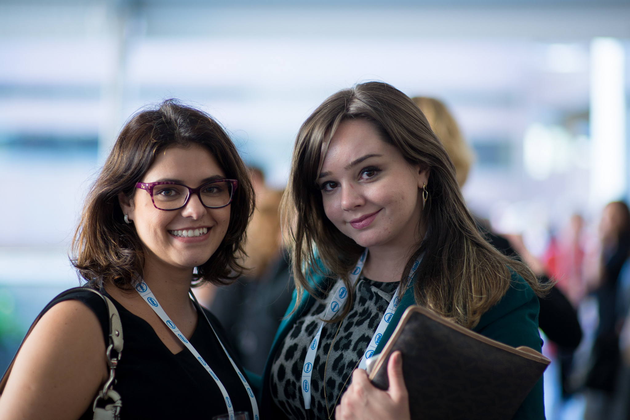 two young women at a conference